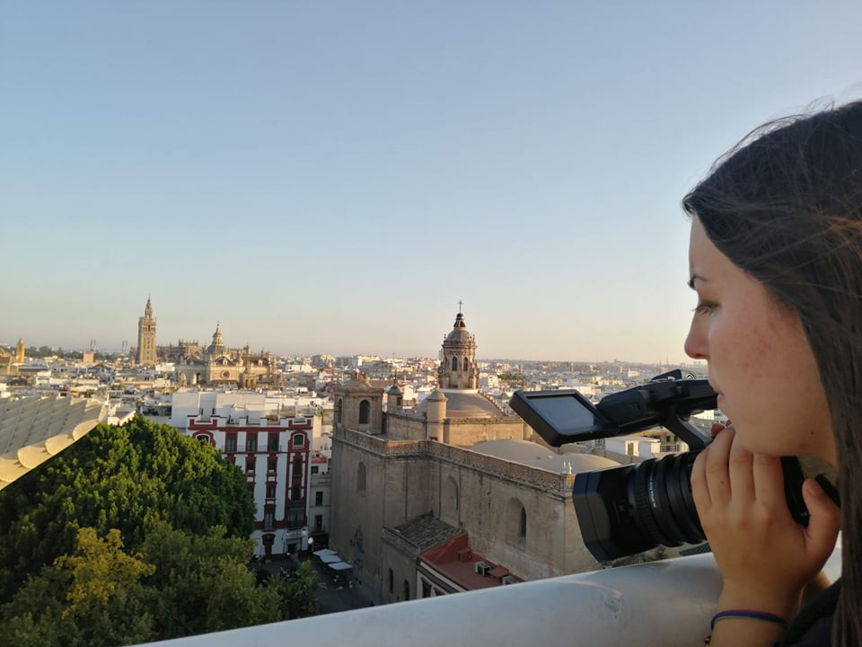 Paulina filming from a roof